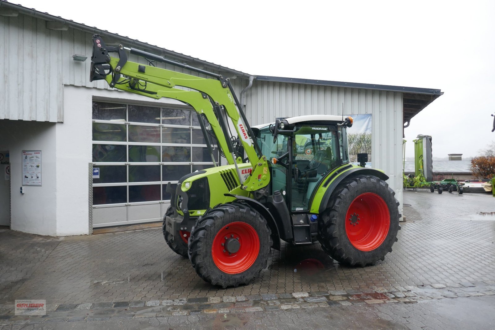 CLAAS Arion 420 CIS+ with FL 100E Loader — photo 1